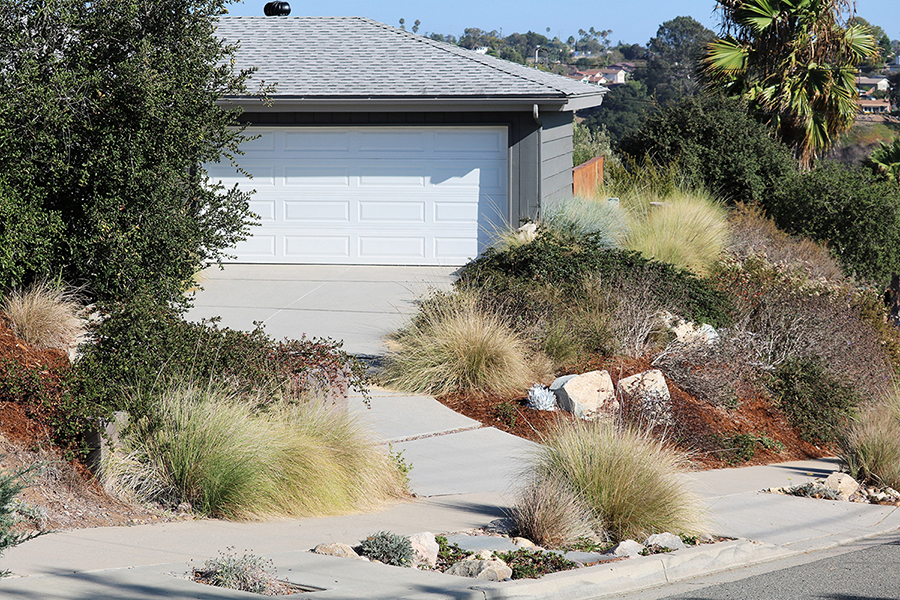 Conejo Valley Audubon Society-Home Fire Safety Guide A closed garage and roof sits at the top of a driveway surrounded by native plants, bushes, and trees.